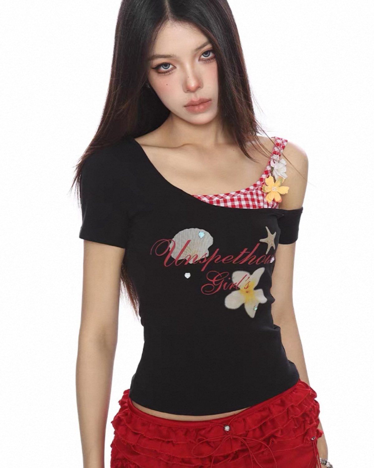 Woman wearing a black top with floral designs and text on a white background