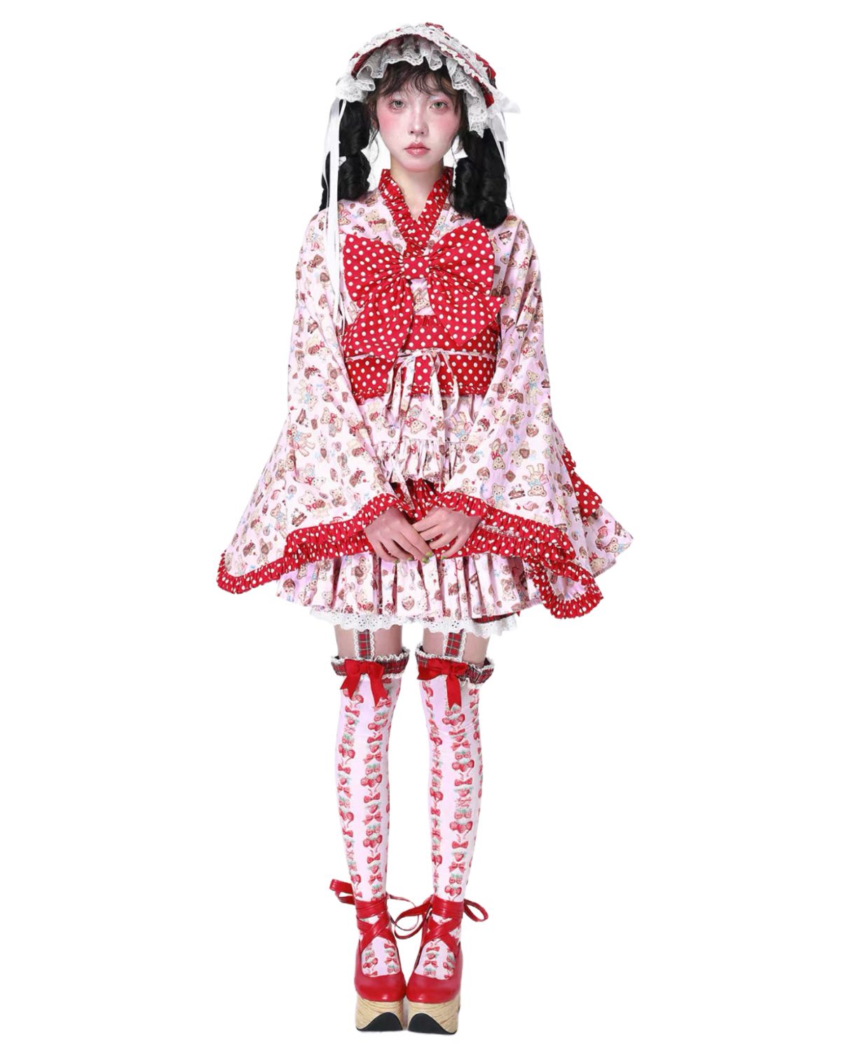 Person wearing a red and white polka dot outfit with matching shoes on a white background