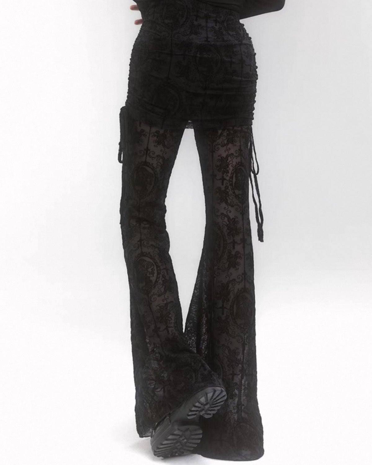 Black textured flared pants on a white background