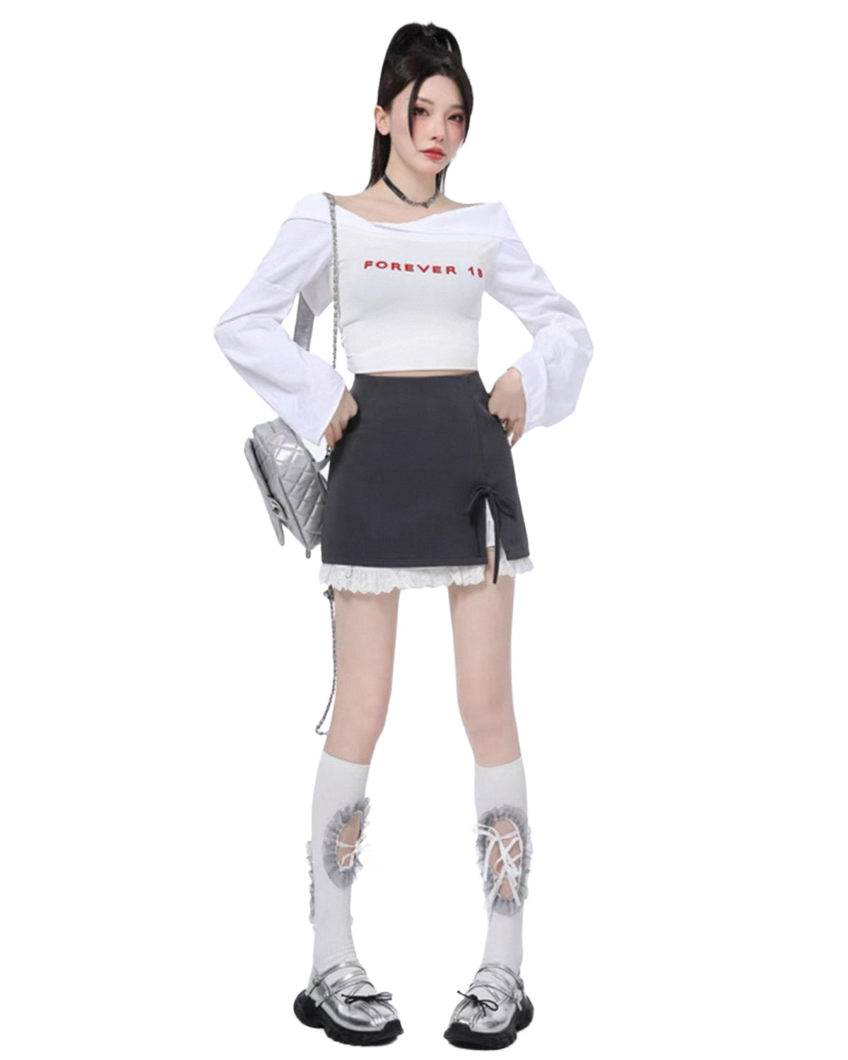 Person wearing a white long-sleeve top with text and a black skirt on a white background