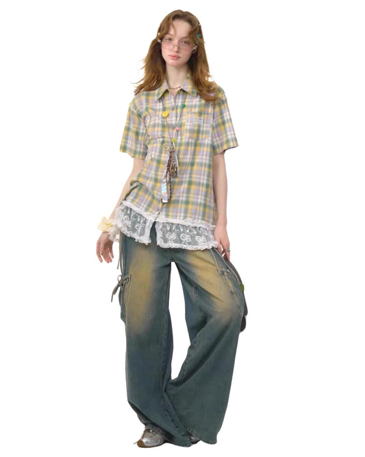 Person wearing a plaid shirt and wide-leg pants on a white background