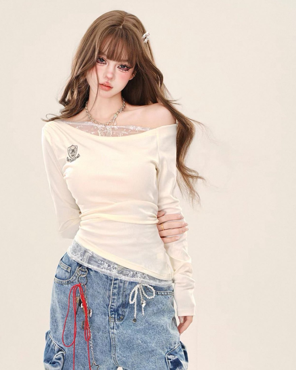 Cream Lace Splice One-Shoulder Top On Model Posing