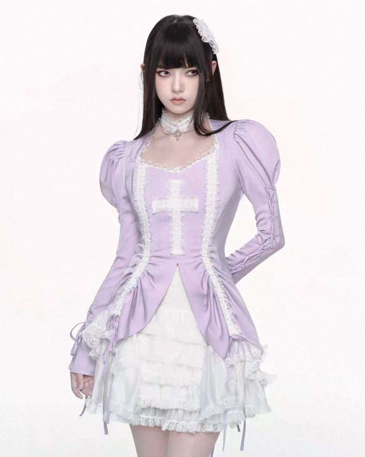 Person wearing a purple jacket over a white dress on a white background