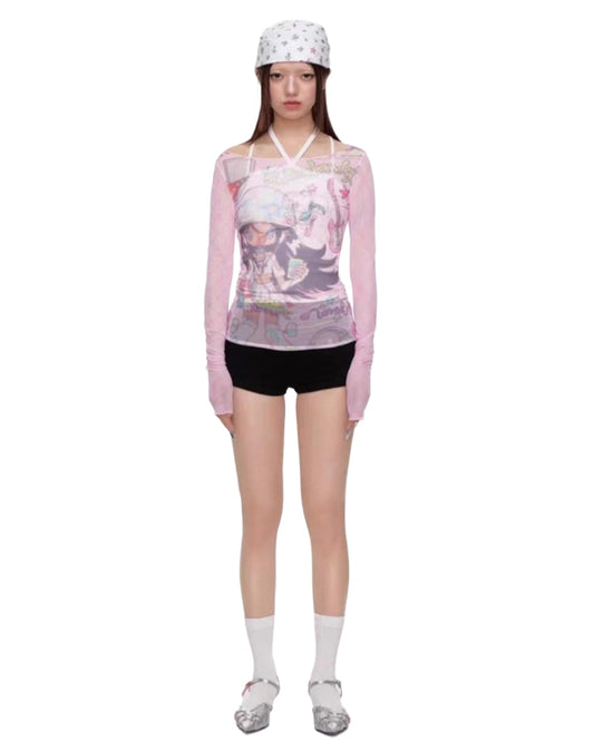 Person wearing a floral long-sleeve top and black shorts on a white background