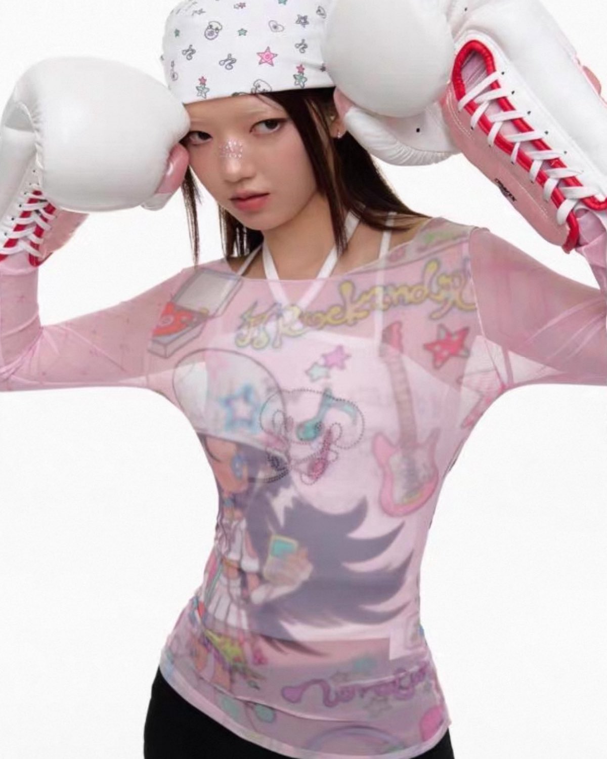 Person wearing a pink boxing outfit with cartoon character design and white boxing gloves.