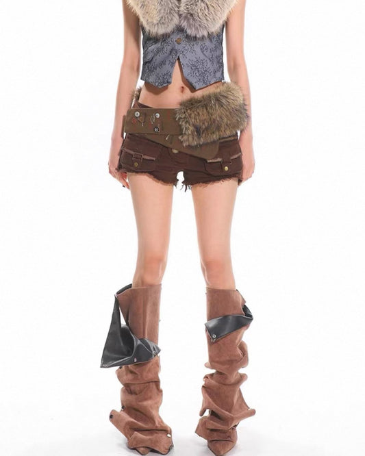Person wearing a unique outfit with fur accents and high boots on a white background