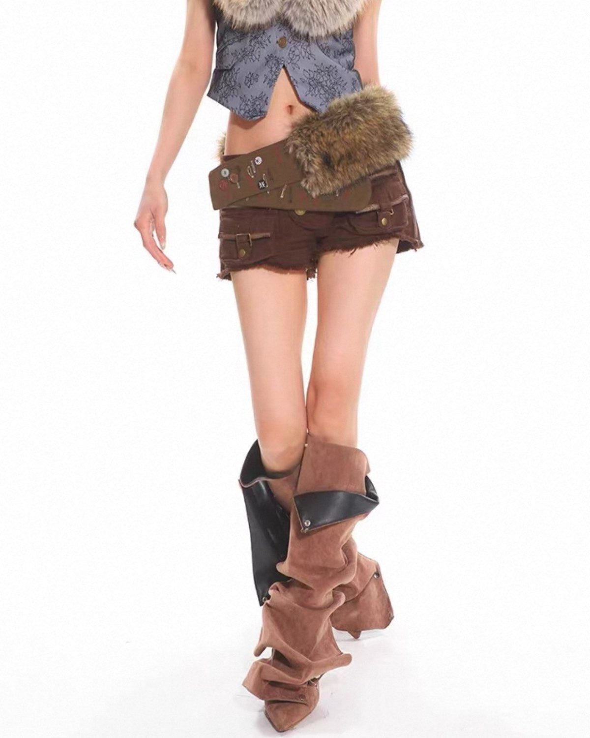 Person wearing a steampunk-style outfit with brown boots, shorts, and top on a white background