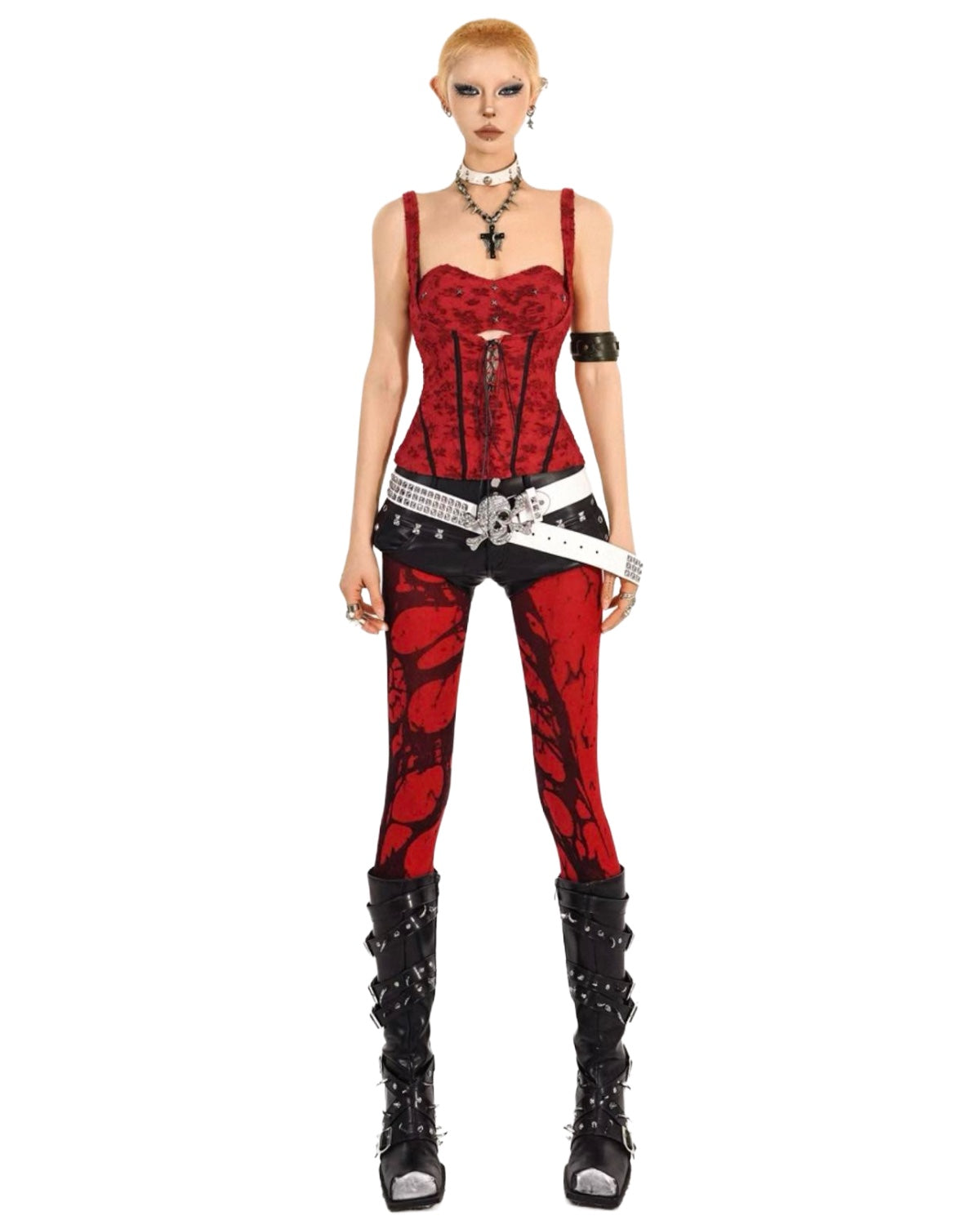Person wearing a red and black outfit with studded details on a white background