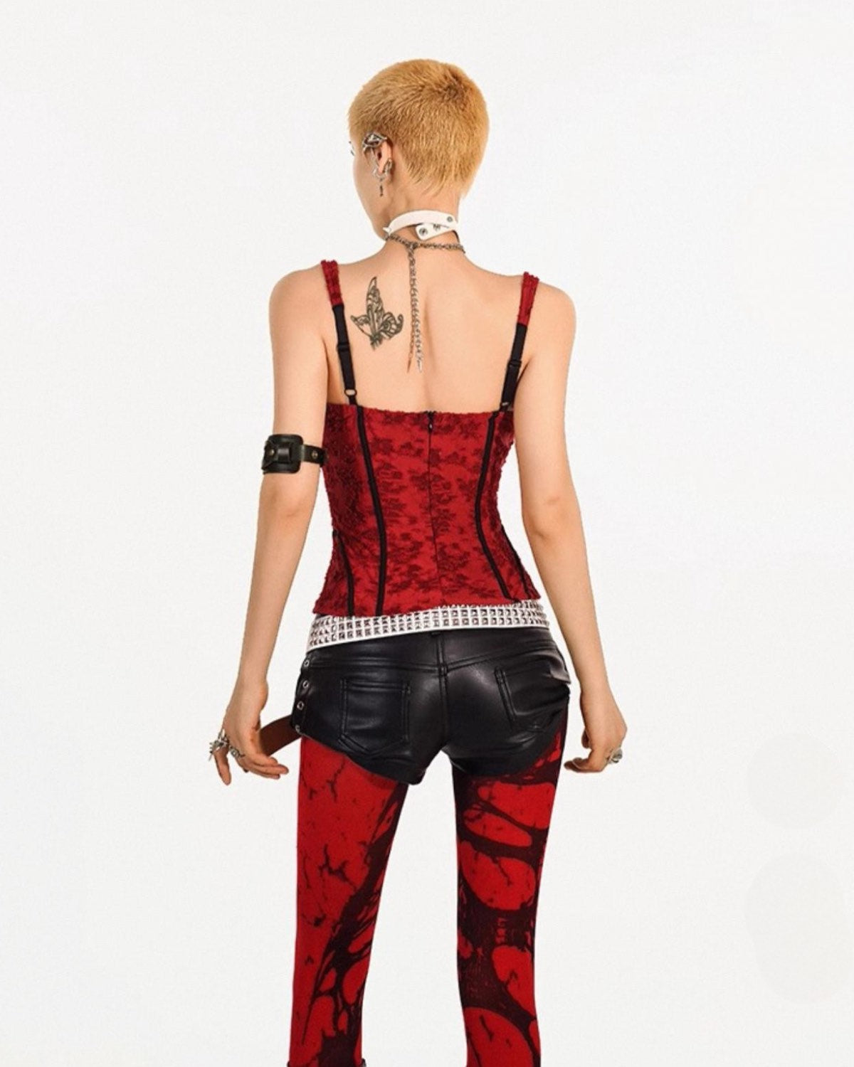 Person wearing a red and black outfit with a white background