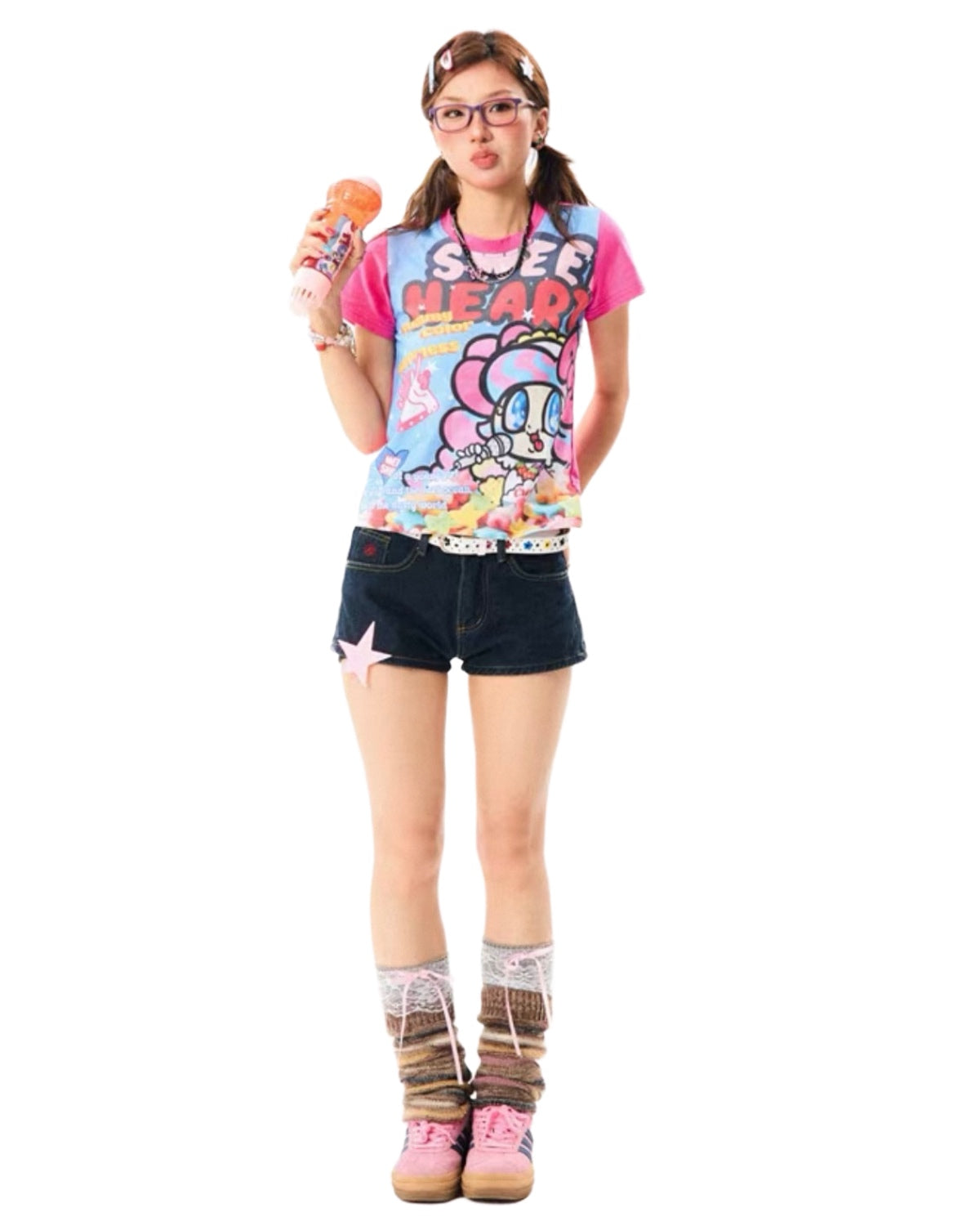 Person wearing a colorful graphic t-shirt and denim shorts on a white background