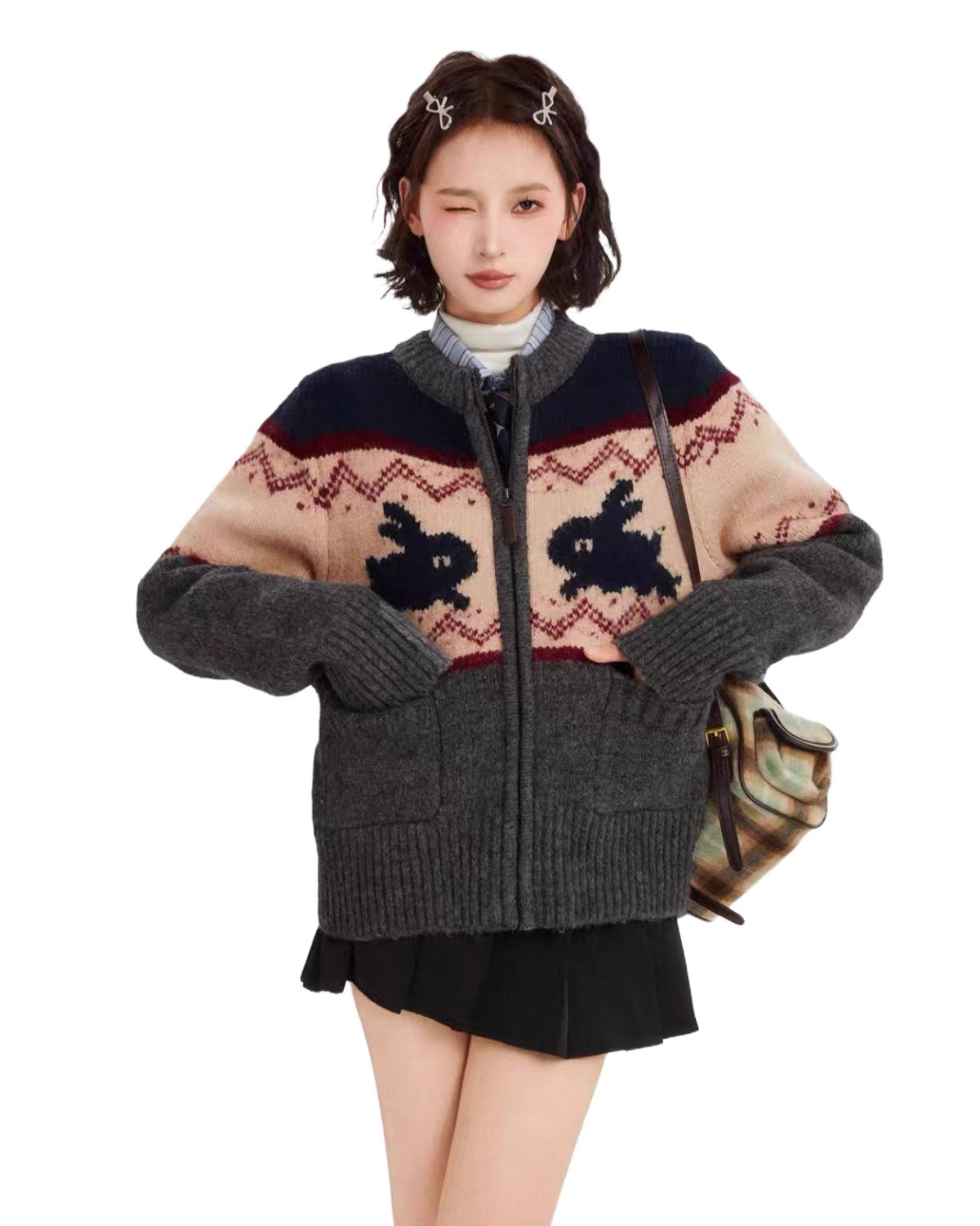 Person wearing a patterned sweater with a white background