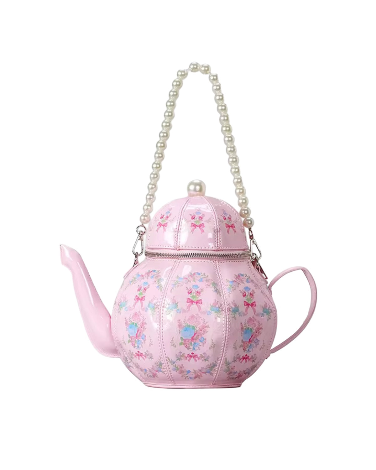 Pink teapot-shaped handbag with floral design and pearl handle on a white background