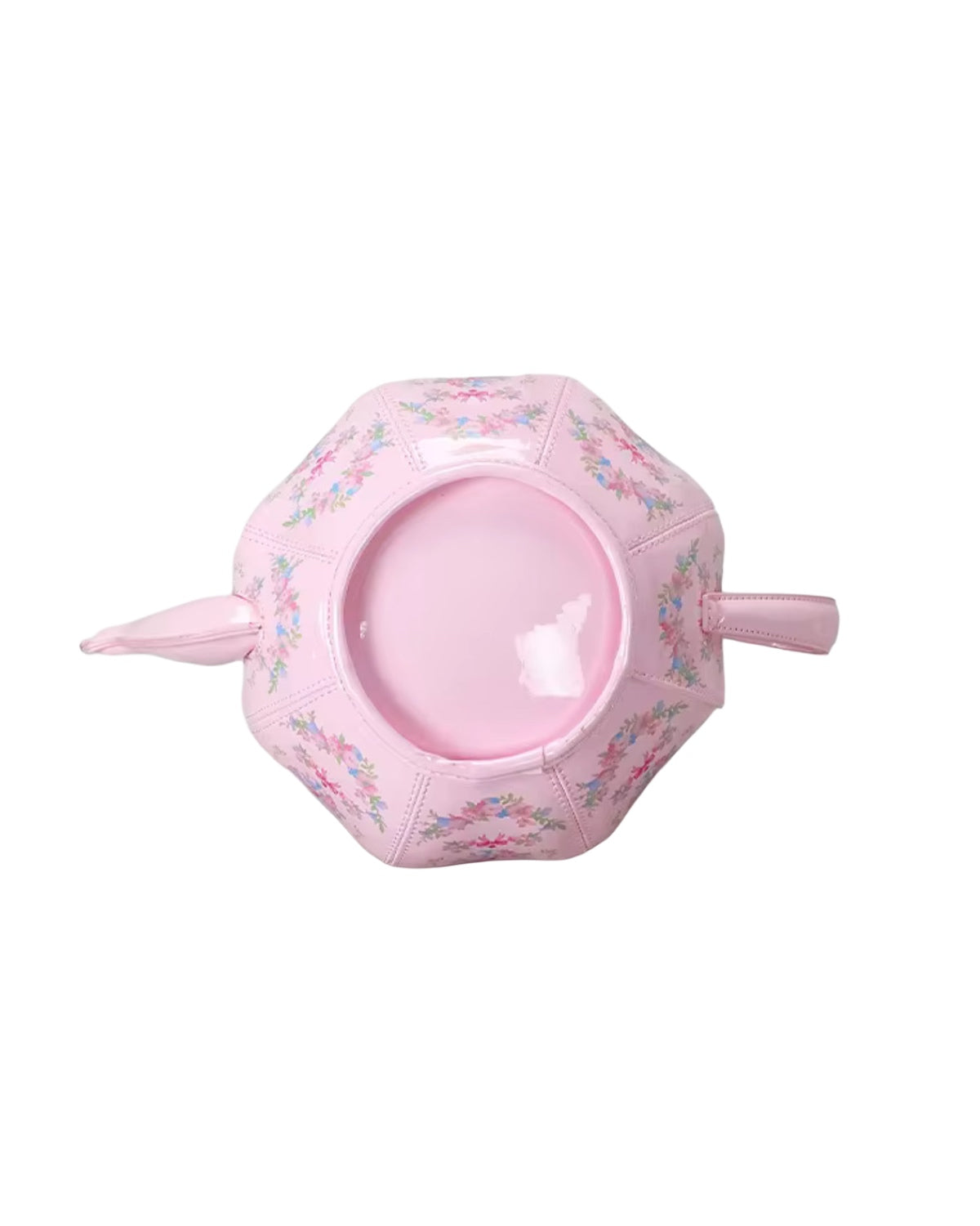 Pink inflatable pool toy with floral design on a white background
