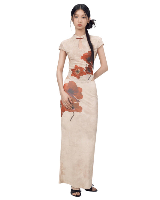 Woman wearing a long, floral-patterned dress on a white background