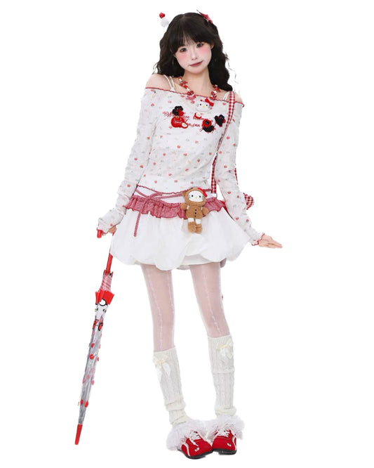Person wearing a white outfit with red accents and a skirt, holding a red umbrella on a white background