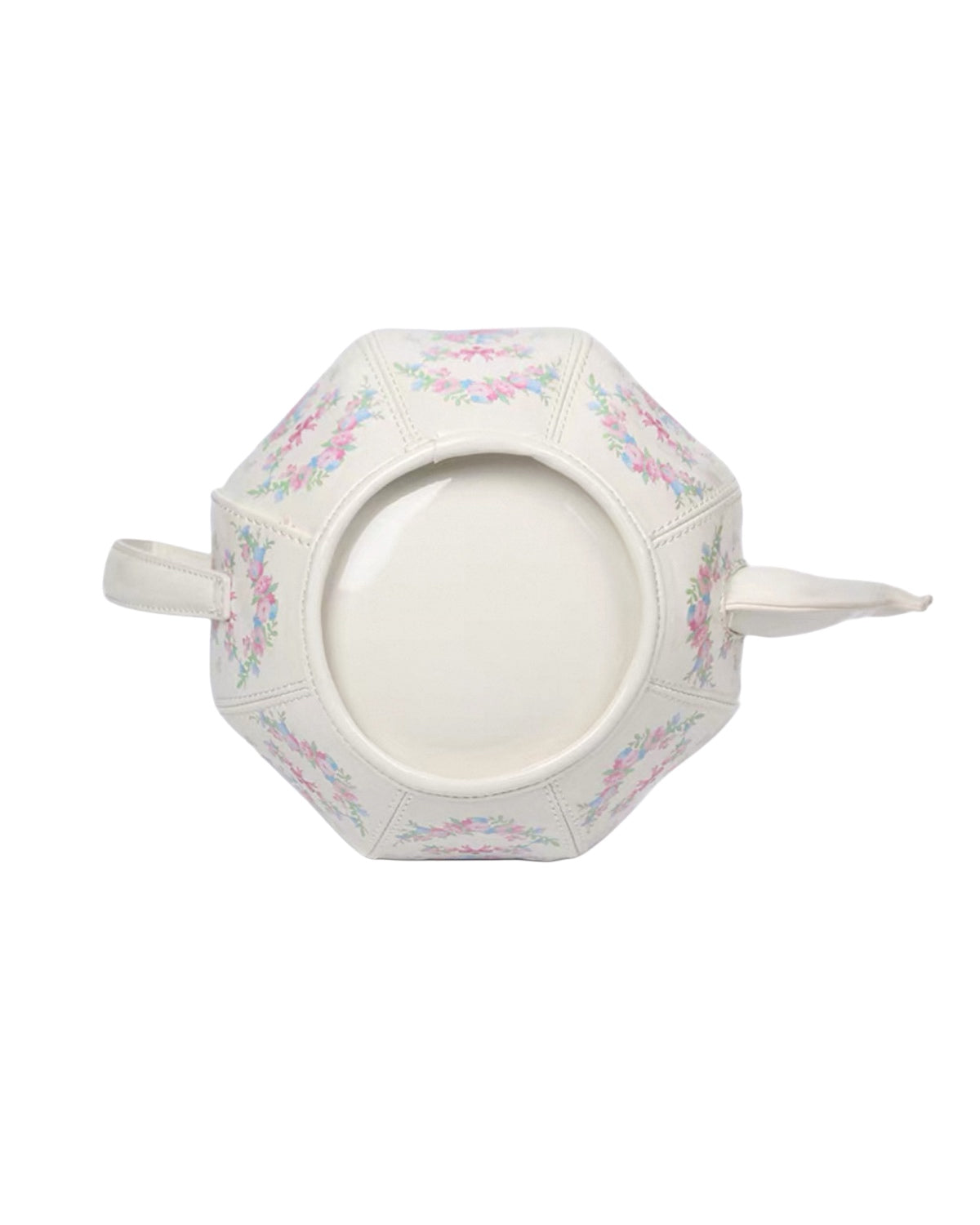Decorative hexagonal plate with floral patterns on a white background